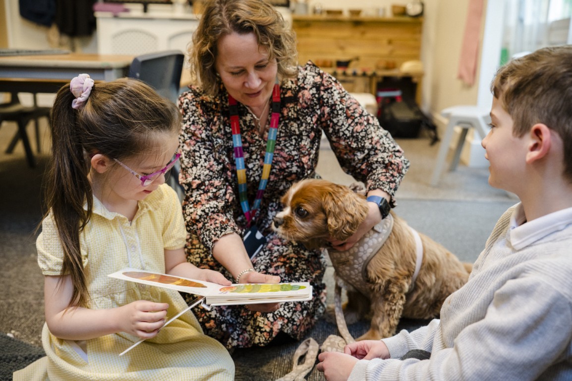 Millie the dog with pupils Emilie and Harry